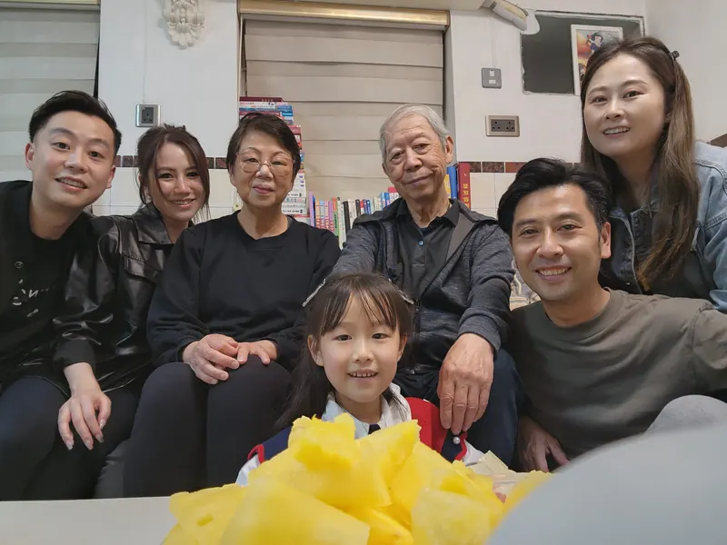 Ken with his family at home